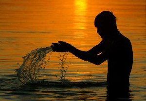 A Hindu devotee bathes in the River Ganges.